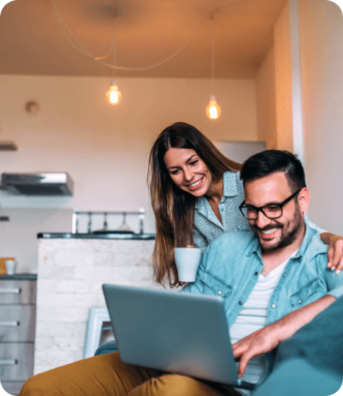 couple smiling together while looking at financial options in Waukegan