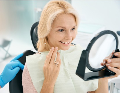 A photo of person smiling with implants