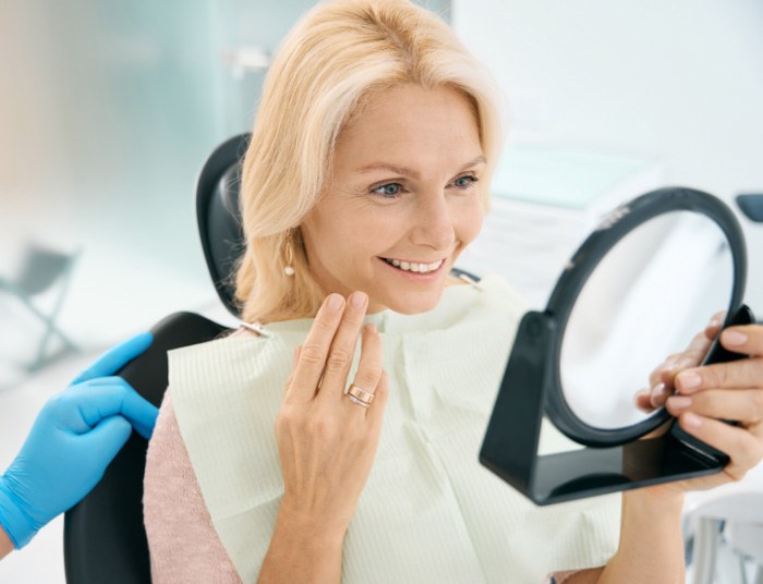 A photo of person smiling with implants